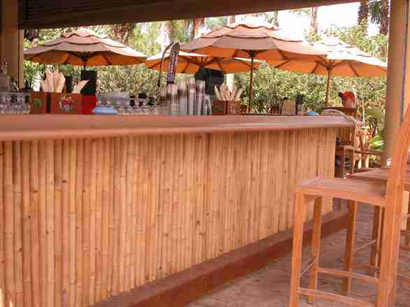 solid bamboo screen covering a bar front