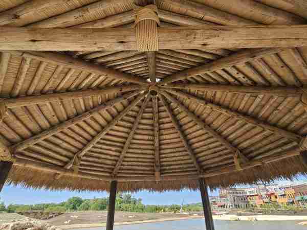 eucalyptus and thatch gazebo underneath